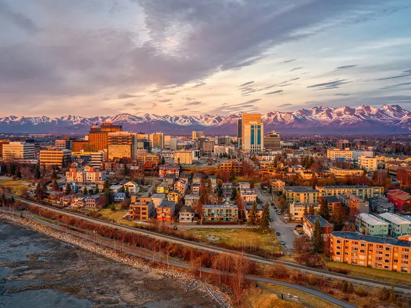 Aerial view of downtown Anchorage, Alaska, with the Chugach Mountains in the background